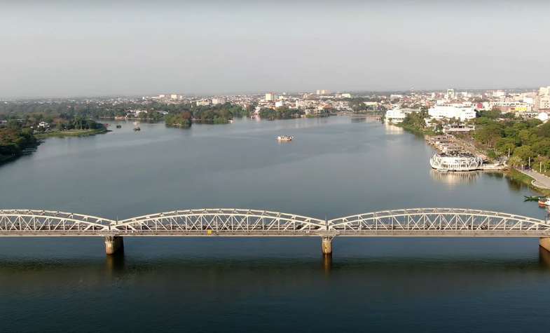 observe Hoi An ancient city from a boat on Thu Bon river
